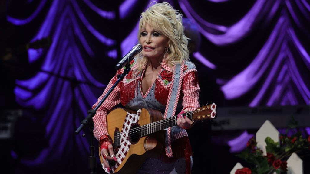 Dolly Parton performing on stage.