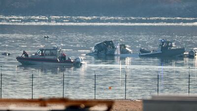 ARLINGTON, VIRGINIA - JANUARY 30: Emergency response units search the crash site of an American Airlines plane on the Potomac River after an accident last night while on approach to Reagan National Airport on January 30, 2025 in Arlington, Virginia. The American Airlines flight from Wichita, Kansas collided midair with a military Black Hawk helicopter while on approach to Ronald Reagan Washington National Airport. According to reports, there were no survivors among the 67 people on both aircraft. (Photo by Kayla Bartkowski/Getty Images)